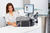 FARGO DTC1250e System in office with girl printing ID cards